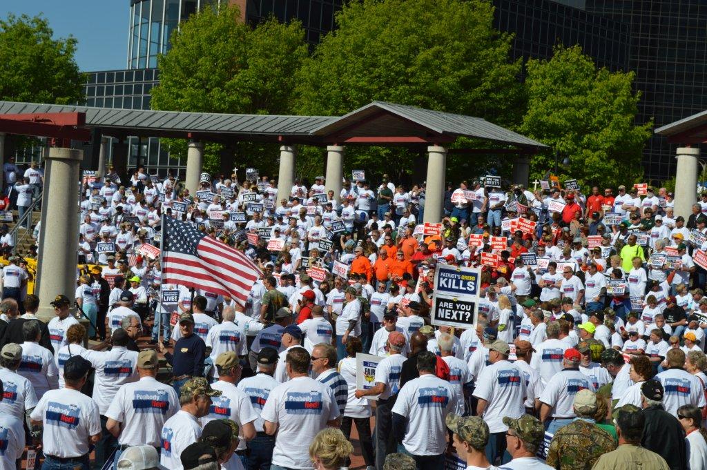 Mine Workers are joined by other union members and allies at an April 29 rally seeking justice for workers and retirees outside the Peabody Energy headquarters in St. Louis. 